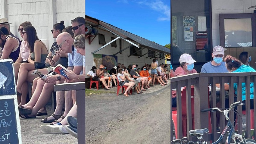 Tourists waiting patiently in long lines